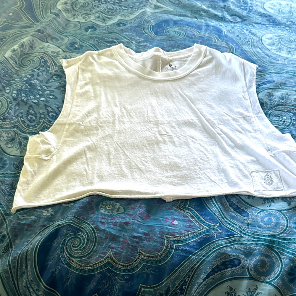 Free People Movement White Inspire Tank Top. 
Very comfortable. 5 Star Rating